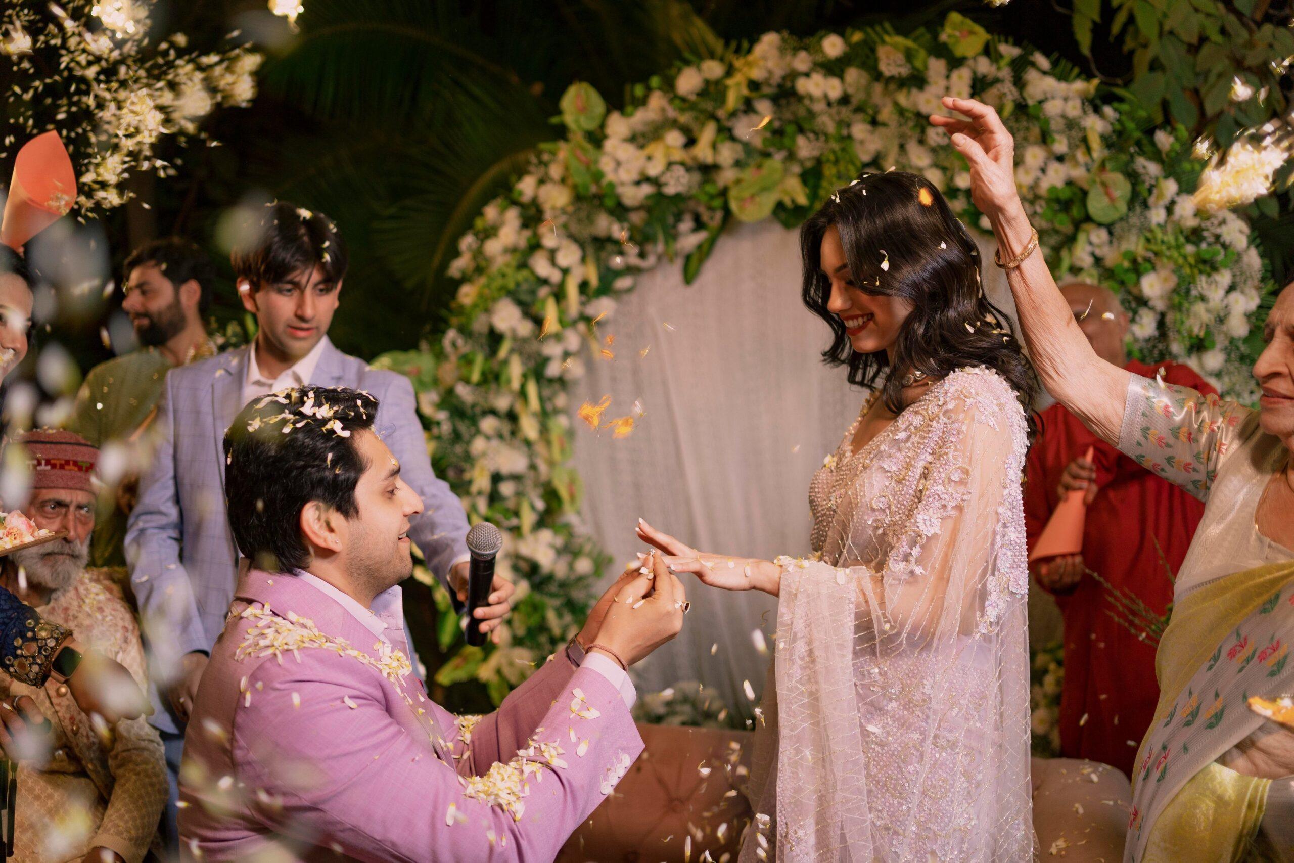 Groom placing ring on his bride's finger during wedding in Mumbai captured by KB Studio photographer